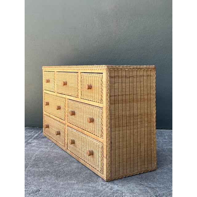 Bring a touch of organic warmth and breezy coastal charm to your interior with this exceptional 7-drawer vintage rattan...