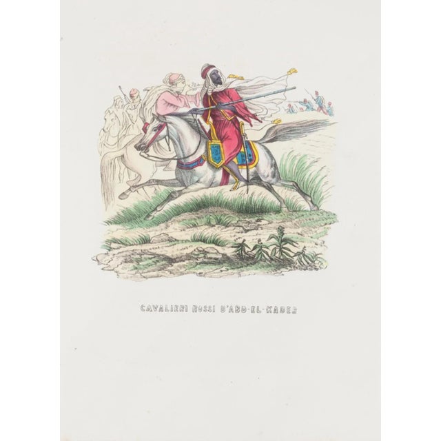 Red Knights of D'Abd-el-kader is an original Hand-colored lithograph on paper realized in 1846 by an Anonymous artist....
