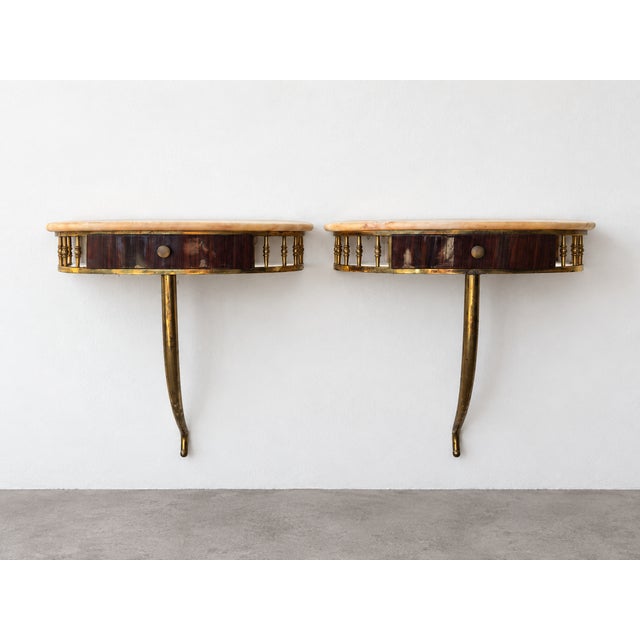 A refined pair of small wall-mounted console tables, beautifully suited as floating bedside tables or entryway trinket...