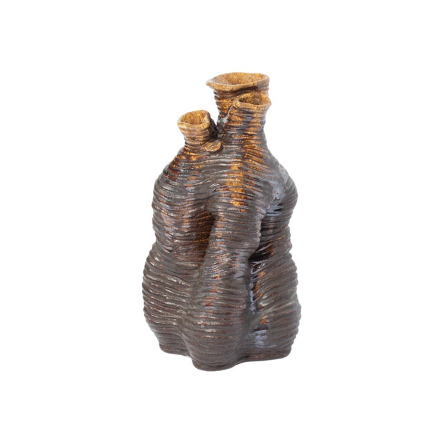 A studio pottery vase by American artist Newell Hillis Arnold (1906-1988). This brown vase features an abstract, organic...