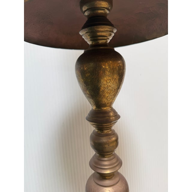 Design Plus Gallery presents a Floor Height Etched Brass Candle Holder with Moroccan Style. This tall piece is four feet...