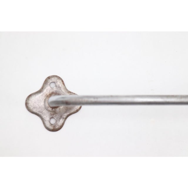 Vintage surface mount steel towel rack with a nickel finish and clover shaped backplates. The original mounting screws are...