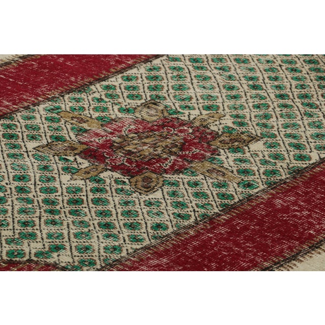 Made with hand-knotted wool and originating circa 1960-1970, this 6x10 vintage Turkish rug is an exciting new piece in Rug...