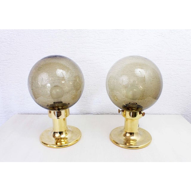 Superb duo of Space Age table lamps in smoked glass. This duo is truly original and seems to have its origins in Germany....