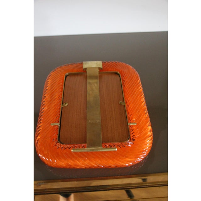 This beautiful vertical photo frame is purely in the vénitien glass manufacturing tradition.The technique uses to get this...