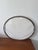 Charming antique oval mirror with a wooden frame and gilt stucco, adorned with elegant foliate motifs. A beautiful...