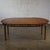 Handsome vintage MCM (a.k.a. Mid-Century Modern) to Campaign style round to oval expanding dining table attributed to the...