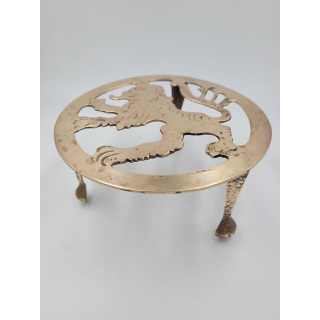 This exceptional 19th-century brass trivet celebrates the storied "Lion Rampant," the historic royal emblem of Scotland....