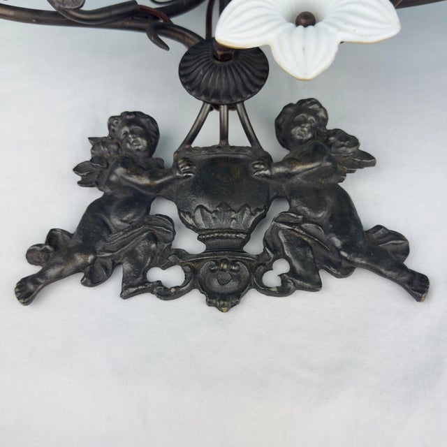 Ebony Vintage 7 Light Wrought Iron Wall Sconce With Milk Glass Flowers & Cherub Motif - Matching Sconce Available Separately For Sale - Image 8 of 12