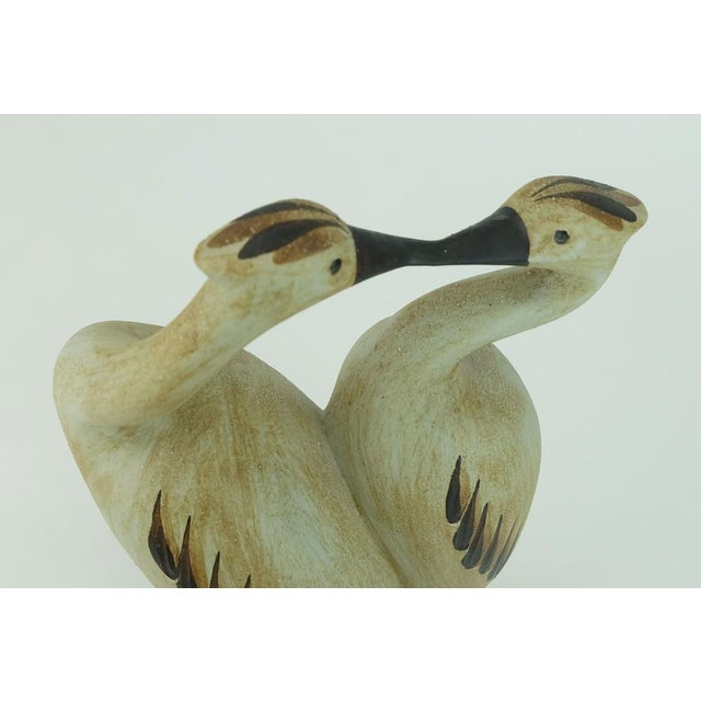 1970s ceramic figurine manufactured by Sgrafo. A pair of cranes in different shades of brown and beige. Signed to bottom...