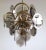 Vintage Italian chandelier with five tiers of smoky beveled glass discs mounted on brass frame, with a half moon brass...
