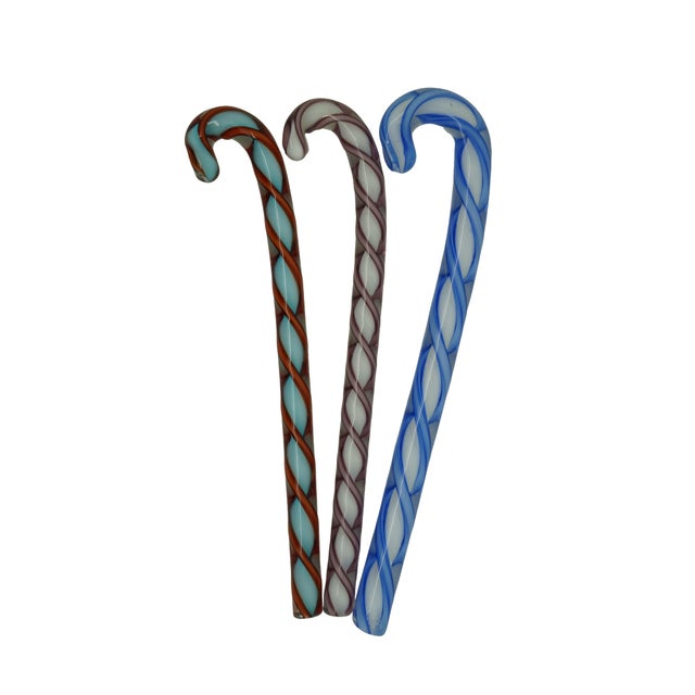 Lot of thirteen vintage Italian Murano glass wrapped candies and candy canes. Dimensions: Candy Cane - 4.75" x 1" x 0.25"...