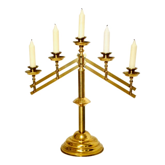 Large Mid 20th-Century five tiered brass altar style candelabra. It has a key on the reverse that loosens the articulating...