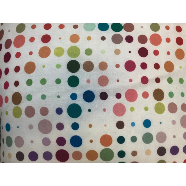 The pillow measures 22 in.² and the fabric is cotton and linen. The insert is stuffed with feather and down