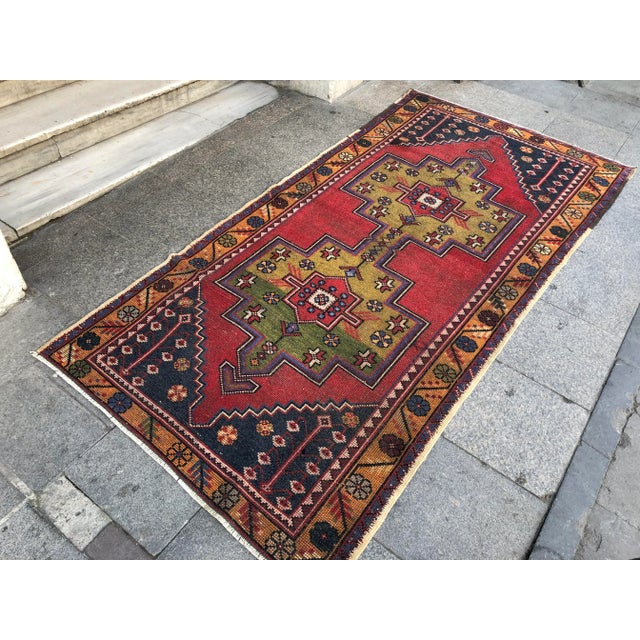 This is a vintage Turkish Oushak rug from the 1960s. The piece was hand-knotted.