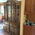 this is a two piece china cabinet with two glass doors in the upper section with glass shelves an it is lighted. The...