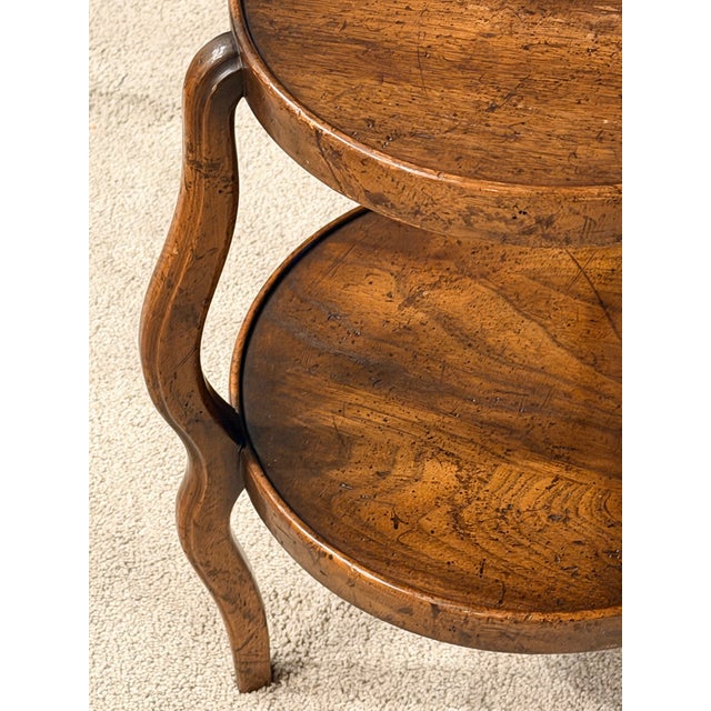 Good looking English walnut accent table that is the perfect size for between to club chairs to set a drink on. Graceful...