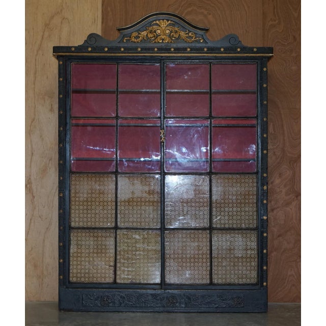 We are delighted to offer for sale this lovely hand carved Victorian Ebonised and Giltwood library bookcase. A very old,...