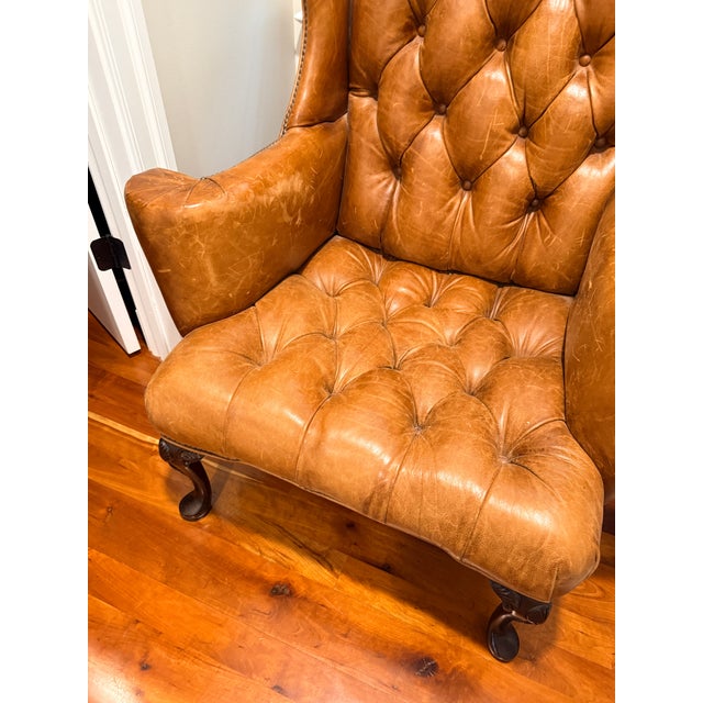 Antique Georgian Leather Wing Chair This statement-making chair is large in scale and ENORMOUS in comfort! The smooth...