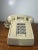 Classic vintage ITT desk telephone in a beige finish featuring a push-button keypad and coiled handset cord. A great retro...