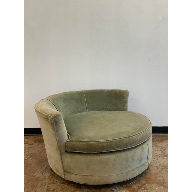 Circa 1970, plush sage green upholstery, single loose cushion, raised on four short turned wood feet, unmarked. Milo...