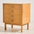 Oak dresser with four drawers and special shaped handles from the 1960s. The surface of the dresser has scratches, stains...