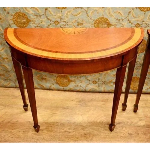 Highly refined pair of Sheraton revival console tables in mahogany Simple half moon - demi lune - form Classically tapered...