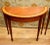 Highly refined pair of Sheraton revival console tables in mahogany Simple half moon - demi lune - form Classically tapered...