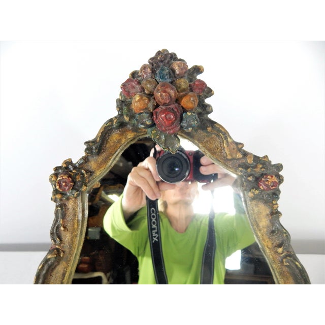 Vintage Florentine polychrome and gilded mirror featuring stylized florets. Original paint and gilding in excellent...