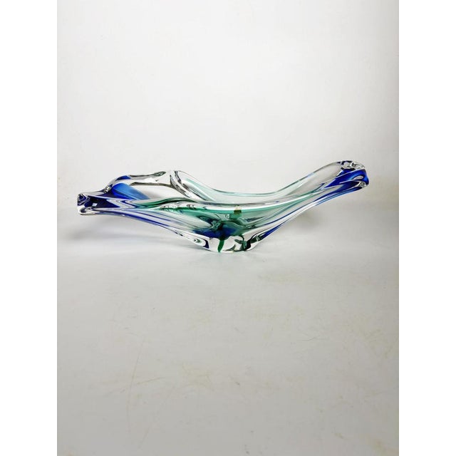 An elegant Italian trinket dish from the 1970s, crafted from hand-blown art glass. Its free-flowing, organic shape, with...
