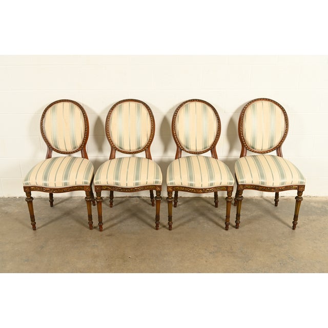 A gorgeous set of four French Regency Louis XVI style dining chairs In the manner of Karges Furniture USA, Circa 1960s...