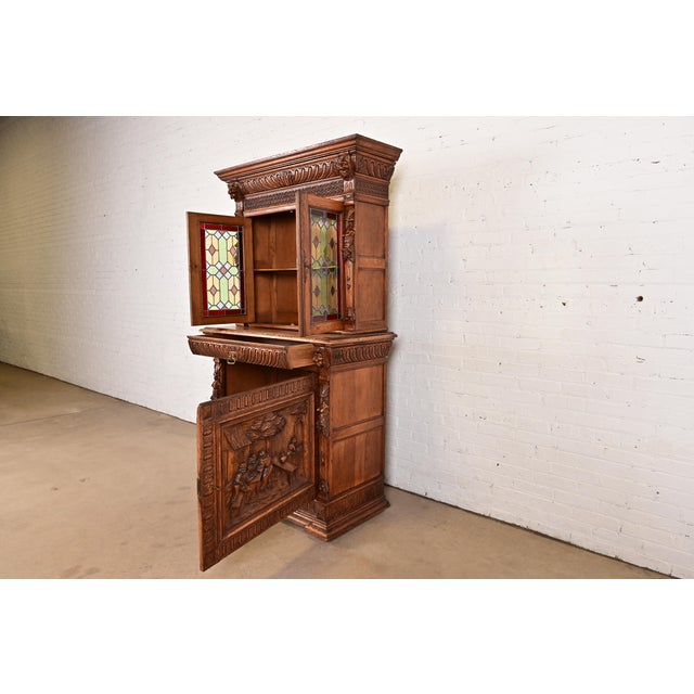 Antique French Renaissance Revival Carved Oak Breakfront Bookcase or Bar Cabinet With Stained Leaded Glass Doors, Circa 1890s For Sale In South Bend - Image 6 of 14