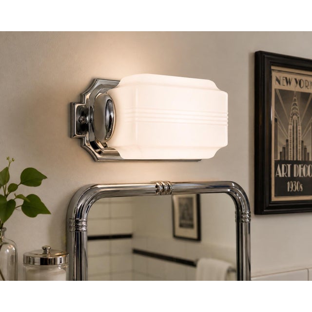 A striking vintage Art Deco white milk glass wall sconce slip shade, dating approximately to the 1930s–1940s. The molded...