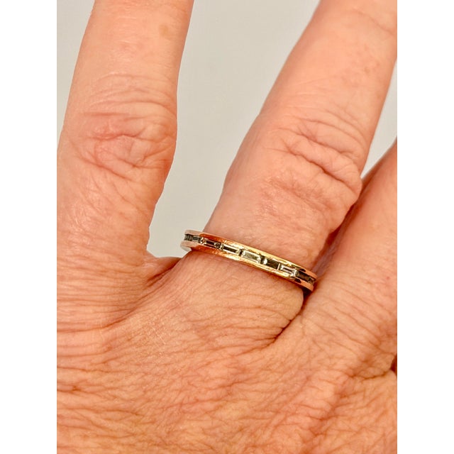 Absolutely lovely 14k rose gold eternity band featuring channel set baguette diamonds. The ring is size 6 3/4 and weighs...