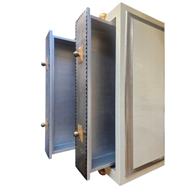 This Exceptional Italian Midcentury Modern Three Drawer Chest in Memphis style it is a stunning piece featuring a bone...