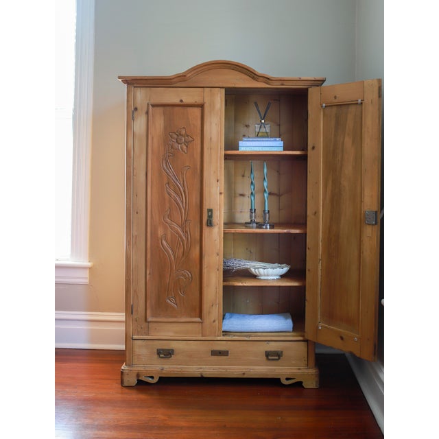 This lovely piece is a French wardrobe, or linen press dating from the late 19th century. Crafted from pine, it has a soft...