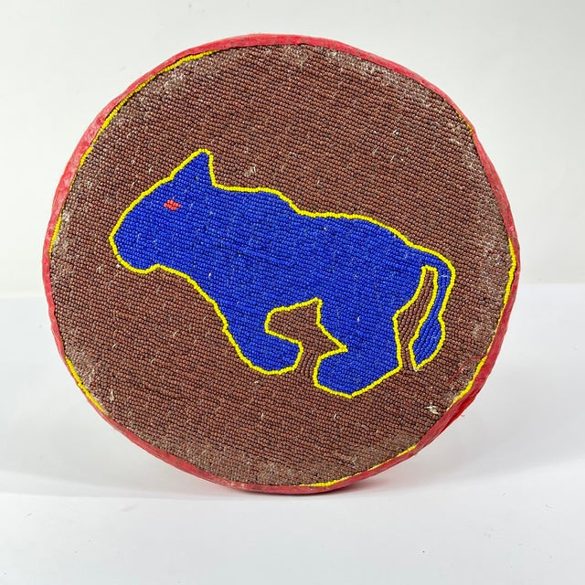 Yoruba Beaded Stool – Throne of Prestige This Yoruba beaded stool, crafted in southwestern Nigeria, represents the...