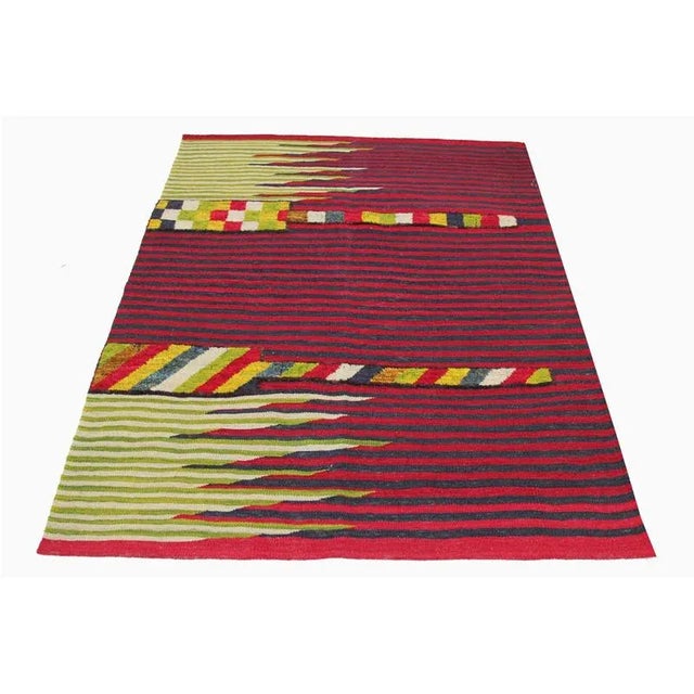 This bewitchingly beautiful example of a tribal Kilim area rug features a contemporary pop of electrifying bright colors...