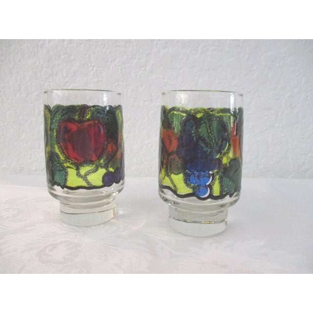 Colorful set of seven vintage Libbey footed tumblers featuring a stained glass design raised fruit-motif around perimeter....