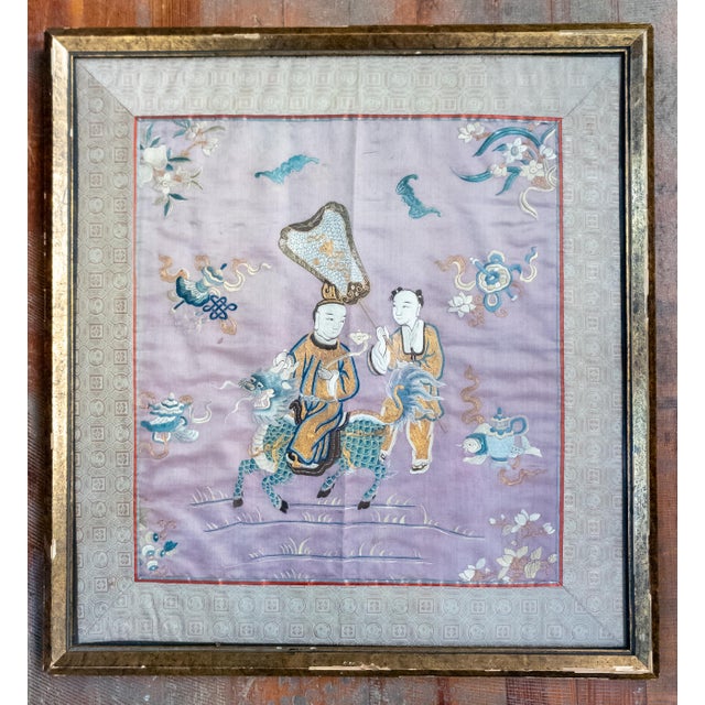 We are selling this gorgeous Chinese Textile fragment. This silk embroidery is done on a purple or lavender ground with...