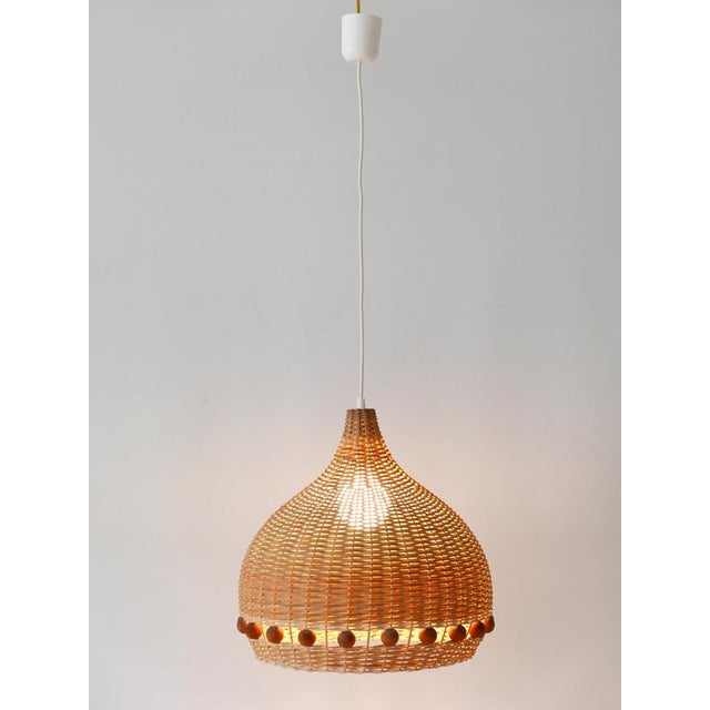 Lovely & highly decorative mid-century modern rattan tulip pendant lamps or hanging lights. Designed & manufactured in...