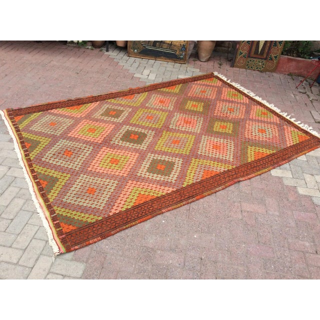 This beautiful, vintage, handwoven kilim is approximately 60 years old. It is handmade, of very fine quality hand spun...