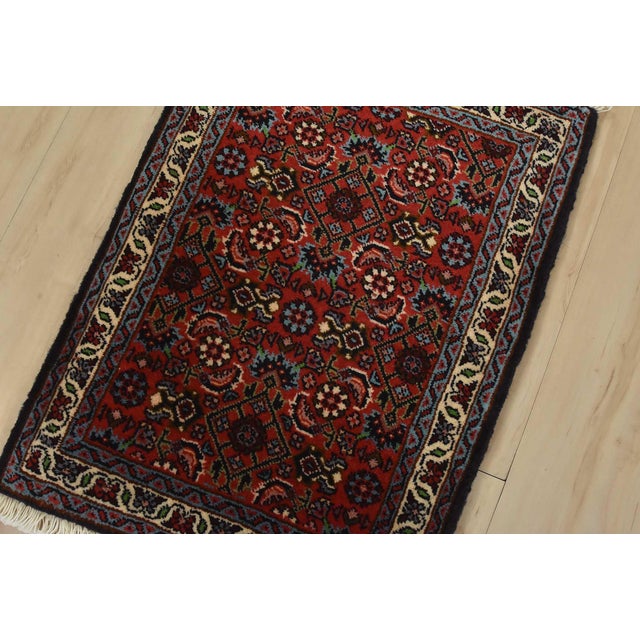 An authentic vintage traditional Bidjar rug hand-knotted with fine wool and natural dyes. This intricately woven oriental...