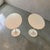 A sophisticated pair of authentic Knoll International oval Tulip side tables designed by Eero Saarinen. Featuring the...
