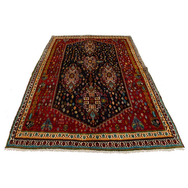 Exuding timeless bohemian luxury and masterful artisan craft, this authentic vintage Shiraz rug features a captivating...