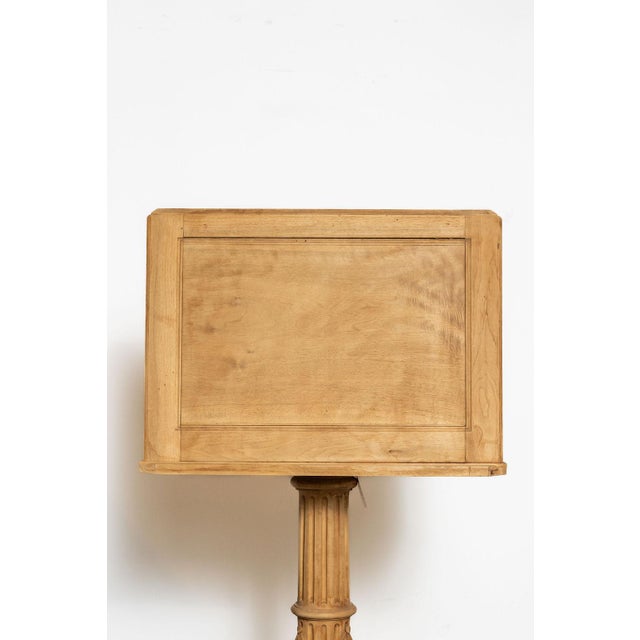 A beautifully sculptural 19th-century French walnut reading stand or lectern featuring a hand-carved fluted column raised...