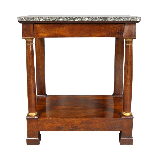 Rectangular original marble top over a frieze with drawer, all supported by parcel gilt columns joining a shelf, block feet.