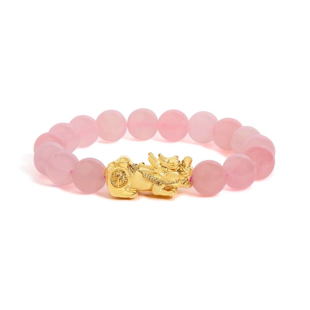 Whisper-soft blush orbs cradle a gleam of fire: sixteen round, cabochon-cut rose quartz beads, each about 10 mm and...