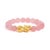 Whisper-soft blush orbs cradle a gleam of fire: sixteen round, cabochon-cut rose quartz beads, each about 10 mm and...