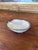 This vintage Japanese pottery dish is crafted in the form of a clam shell and features a pale celadon glaze with fine...